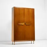Illuminated wardrobe by Gio Ponti, early 1950s, Mahogany-veneered wood, mahogany, glass, brass, offered May 2022
