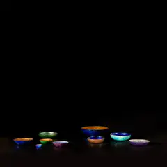 Nine bowls by Paolo De Poli, circa 1958, Enamelled copper, sold May 2022
