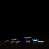 Nine bowls by Paolo De Poli, circa 1958, Enamelled copper, sold May 2022