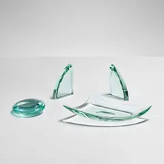 Desk accessories: pair of bookends, vide-poche and photo holder by Pietro Chiesa, circa 1947, Glass, sold May 2022