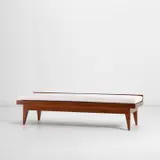 Bench, from the Banca Nazionale del Lavoro, Italy by Gio Ponti, circa 1955, Walnut, walnut-veneered wood, laminated wood, fabric, sold May 2022