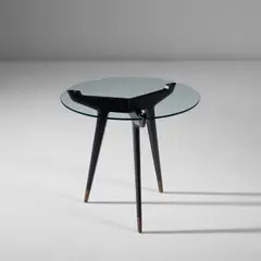 Rare side table by Gio Ponti, circa 1953, Ebonised fruitwood, glass, brass, sold Nov 2022
