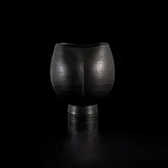 Footed cup by Hans Coper, 1968, Stoneware, black glaze over a textured and incised body, sold Nov 2022