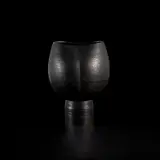 Footed cup by Hans Coper, 1968, Stoneware, black glaze over a textured and incised body, sold Nov 2022