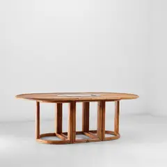 Extendable dining table, from the 'Rising Sun' series by Gabriella Crespi, circa 1975, Malacca rattan covered wood, brass, sold Nov 2022