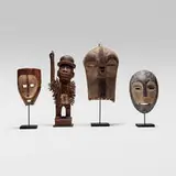 African, Collection of four objects, carved wood, pigment, kaolin, nails, glass