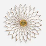 Sunflower wall clock, model 2261A by George Nelson & Associates, 1958-59, walnut and birch plywood, brass, enameled aluminum and steel, sold May 2025