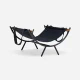 Log holder by George Nelson & Associates, canvas, powder-coated steel, walnut, sold May 2025