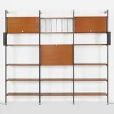 CSS (Comprehensive Shelving System) by George Nelson & Associates, 1959, walnut, enameled and brushed aluminum, polished aluminum, sold May 2025