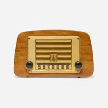 Charles and Ray Eames, Radio, model 588A, 1946, mahogany plywood, plastic, Bakelite