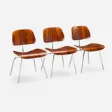 Charles and Ray Eames, DCMs, set of three, rosewood plywood, chrome-plated steel, rubber