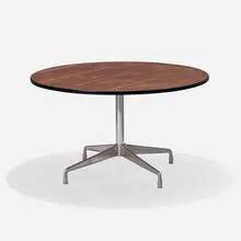 Aluminum Group dining table by Charles and Ray Eames, rosewood, cast aluminum, steel, rubber, plastic, sold May 2025