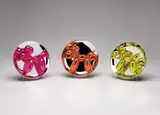 Jeff Koons, Balloon Dogs Presentation Set (Magenta, Orange, Yellow), 2015, The compete set of three porcelain multiples painted in chrome, all contained in the original Styrofoam-lined presentation box with silver printed signature, with the original plastic stands