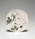 Tête de chèvre de profil (Goat's Head in Profile) (R. 107) by Pablo Picasso, 1950, White earthenware round plate painted in black, white and green, with partial brushed glaze, sold Jun 2021