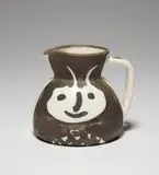 Têtes (Heads) (R. 367) by Pablo Picasso, 1956, White earthenware turned pitcher painted in black, white and green, with partial brushed glaze, sold Jun 2021