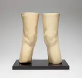 Claes Oldenburg, London Knees (A. & P. 51, A. 677), 1966, The pair of cast flexible latex sculptures coated in polyurethane with single acrylic plastic base, with accompanying set of three green cloth-covered paper board folders containing postcards and reproductions related to The Knees as London Monument Project , with justification, all contained in the original buckram-covered travelling case with printed title and date