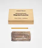 Joseph Beuys, Wirtschaftswert Signiertusche (Economic Value Signature Ink) (S. 469), 1983, Multiple comprised of a block of Signiertusche ink in the original wrapper, with hand-written additions, and a glass pen, all contained in the original wooden box with printed artist's name and title