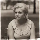 Woman with a locket in Washington Square Park, N.Y.C. by Diane Arbus, 1965, Gelatin silver print, printed later by Neil Selkirk, sold May 2021