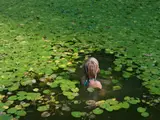 Lucas Foglia, Maddie with Water Lilies, North Carolina from Human Nature, 2008, Archival pigment print, mounted