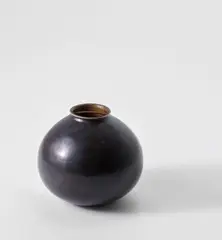 Vase by Jean Dunand, 1915, Patinated metal, brass, sold Jun 2021