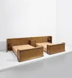 Jean Royere, Two beds with integrated headboard and bedside table, 1955-1958, Stained oak, stained and partially painted oak-veneered wood, brass, fabric