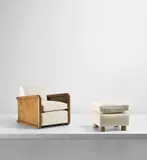 Jean Royere, 'Croisillon' armchair and ottoman, 1955-1958, Stained oak, stained and partially painted oak-veneered wood, fabric