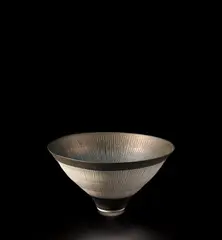 Conical bowl by Lucie Rie, circa 1978, Porcelain with manganese glaze, radiating inlaid and sgraffito design, sold Jun 2021