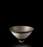 Conical bowl by Lucie Rie, circa 1978, Porcelain with manganese glaze, radiating inlaid and sgraffito design, sold Jun 2021