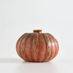'Coloquinte' vase by Jean Dunand, circa 1913, Patinated and lacquered metal, sold Nov 2021