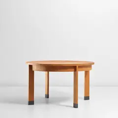 Extendable dining table by Jacques Quinet, circa 1973, Cherry-veneered wood, brass, sold Nov 2021