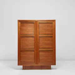 Cabinet by Jean Royere, circa 1950, Walnut-veneered wood, oak, brass, sold Nov 2021
