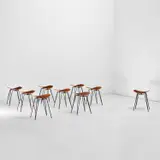Set of nine stools by Gio Ponti, circa 1951, Beech-veneered plywood, painted brass, sold Nov 2021