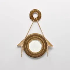 Hanging mirror by Carlo Bugatti, circa 1902, Partially-painted vellum-covered wood, repoussé brass, mirrored glass, fabric cord, sold Nov 2021