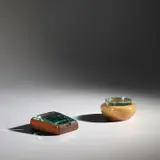 Cigarette box, model no. 1132 and lidded box by Pietro Chiesa and Fontana Arte, circa 1938, African mahogany, fruitwood, glass, sold Nov 2021