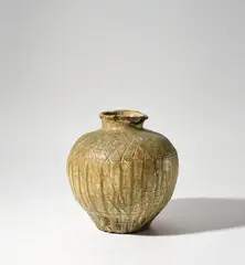 Rosanjin, 'Iga' type jar, circa 1955, Stoneware, flowing ash glaze over a body with incised designs around the shoulder