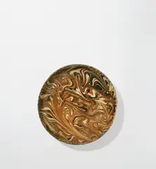 Plate by Bernard Leach, circa 1930, Earthenware, marbled slips beneath a clear glaze, made on a hump mould with crimped rim, sold Nov 2021