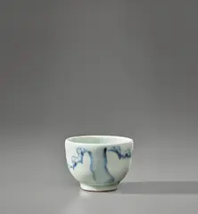 Bowl with cherry tree design by Bernard Leach, 1934, Porcelain, brushed cobalt blue and clear glazes, sold Nov 2021