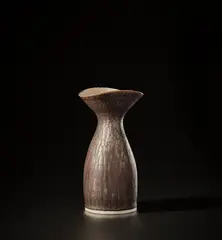 Vase by Lucie Rie, circa 1960, Porcelain, manganese and white glazes with sgraffito design to the interior of the lip, sold Nov 2021