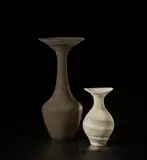 Vase with flaring lip by Lucie Rie, circa 1974, Stoneware, mixed clays combining with the glaze to produce an integral spiral of soft white and blue colours, sold Nov 2021