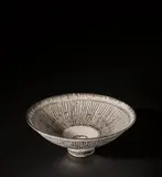 Open bowl by Lucie Rie, circa 1980, Stoneware, inlaid with a radiating managanese design beneath a white 'Dolomite' glaze, sold Nov 2021