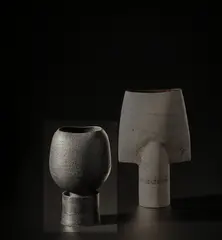 Cup on stand by Hans Coper, circa 1975, Stoneware, black glaze over a textured body, the interior with a stem holder, sold Nov 2021