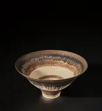 Footed bowl by Lucie Rie, circa 1978, Porcelain, pale yellow glaze with bands of manganese inlay repeated inside and out, a running band of bright gold to the, sold Nov 2021