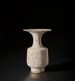 Vase with flaring lip by Lucie Rie, circa 1985, Stoneware mixed with manganese minerals beneath a light grey glaze creating an integral speckle, the body with combed de, sold Nov 2021