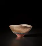 Oval bowl by Lucie Rie, circa 1980, Porcelain, flowing bright golden glaze with turquoise bands inside and out, the foot and well dry terracotta, sold Nov 2021
