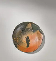 'Pilgrim' dish by Bernard Leach, circa 1968, Stoneware, iron glazes with resist motif of 'the pilgrim walking through mountains', sold Nov 2021