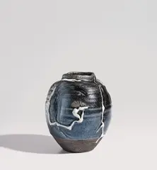 Uichi Shimizu, Vase, circa 1995, Stoneware, lustrous black glaze with white trailed glaze designs over a carved and distorted body
