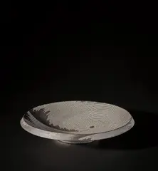 Junko Kitamura, Large dish, circa 2000, Black stoneware, the design impressed and inlaid with porcelain