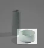 Low cylinder by Edmund de Waal, 2001, Porcelain, pale blue celadon glaze over impressed marks, sold Nov 2021