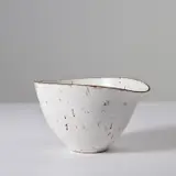 Bowl with pouring lip by Lucie Rie, 1956, stoneware, white glaze with manganese rim and integrated manganese speckle, sold Apr 2021