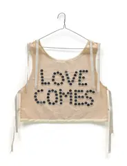 Untitled (Bib) by Tracey Emin, 1993, mirror discs on cotton duck canvas with satin ribbon and dress-making pins on wire hanger, sold Feb 2020